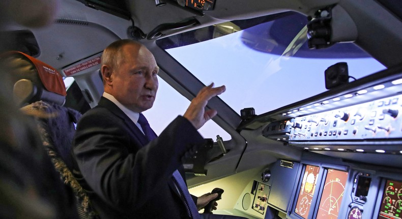 Vladimir Putin in the cockpit of an Aeroflot plane.