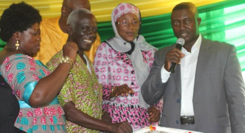 Dr. Afari Gyan cutting his birthday cake