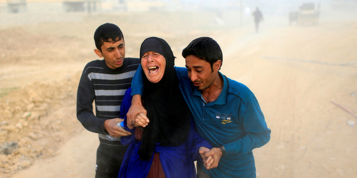 A displaced Iraqi woman cries after she finds out that her 15-year-old son Maitham was killed by an Islamic State mortar in Samah neighborhood, Mosul, Iraq.