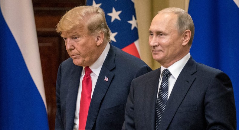 President Donald Trump and Russian President Vladimir Putin arrive at a joint press conference after their summit on July 16, 2018 in Helsinki, Finland.