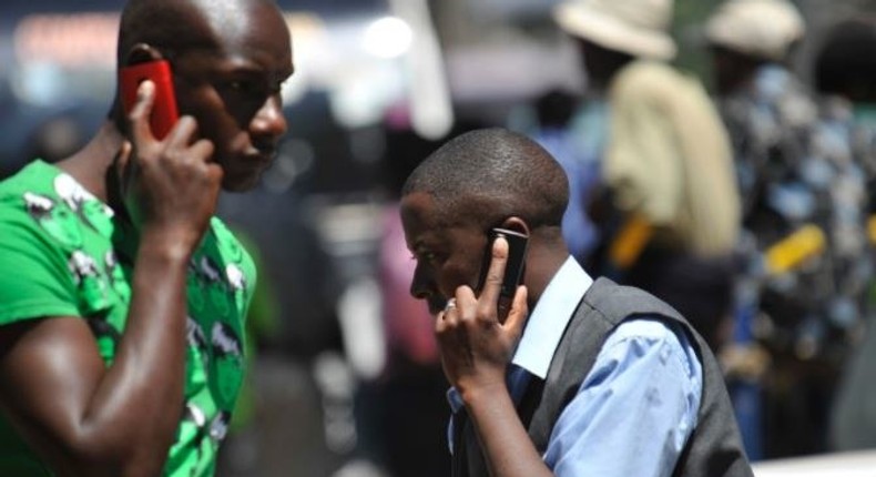 File image of Kenyans calling on their mobile phones.