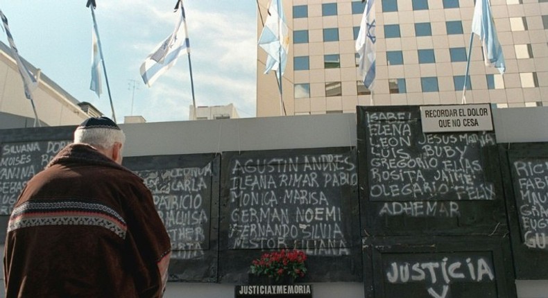 A man stands in front of a memorial to the 86 victims of the 1994 terrorist bombing that razed the AMIA Jewish communnity center in Buenos Aires