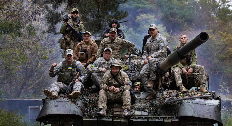 Ukrainian troops ride upon a repaired Russian tank in a wooded area outside the city on September 26 2022 in Kharkiv, Ukraine.Photo by Paula Bronstein /Getty Images