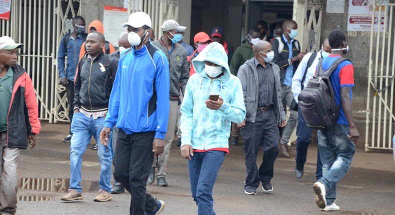 Kenyan citizens wearing masks in public following a government order