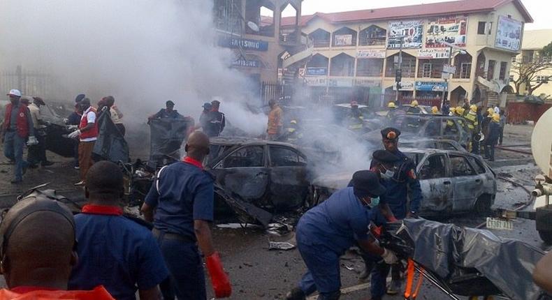 Officials remove dead bodies from a bomb blast scene in Maiduguri, Borno State.