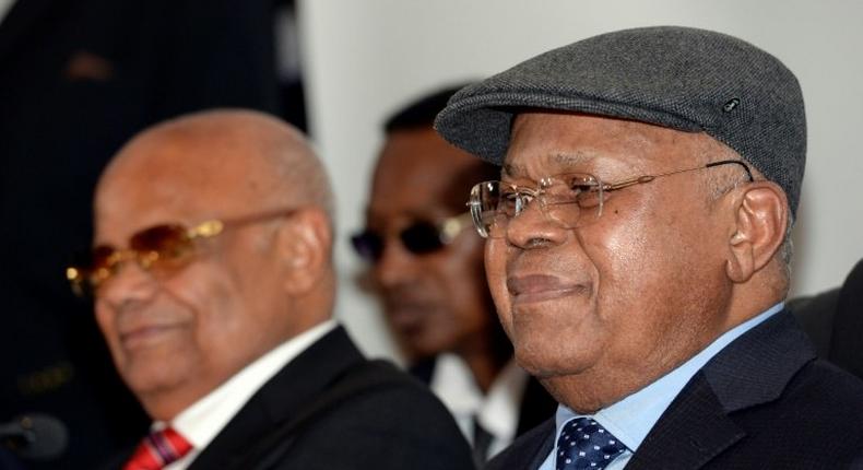 President of the Democratic Republic of Congo opposition party Union for Democracy and Social Progress Etienne Tshisekedi (R) attends a signature agreement with main opposition parties of the Democratic Republic of Congo on June 10, 2016