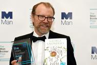 George Saunders, author of 'Lincoln in the Bardo', poses for photographers after winning the Man Booker Prize for Fiction 2017 in London