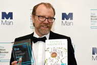 George Saunders, author of 'Lincoln in the Bardo', poses for photographers after winning the Man Booker Prize for Fiction 2017 in London