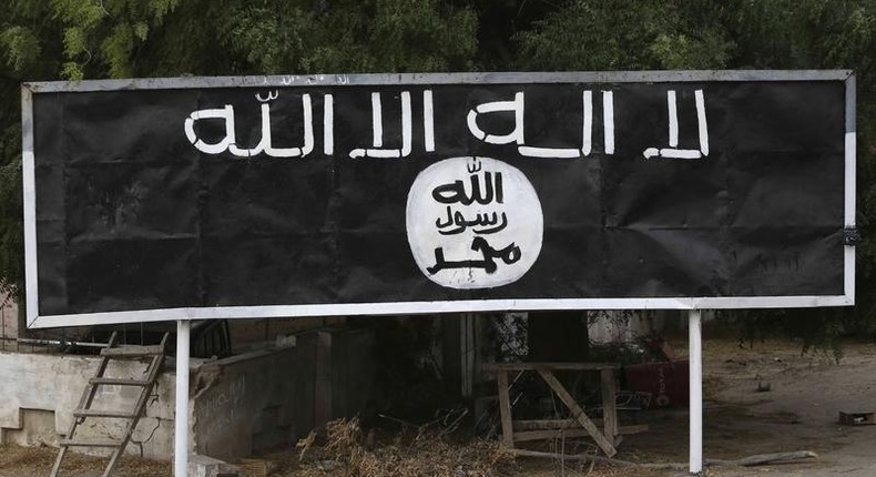 A signpost painted by Boko Haram is seen in the recently retaken town of Damasak, Nigeria, March 18, 2015.  REUTERS/Emmanuel Braun