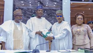 Minister of Education, Prof. Tahir Mamman, receiving the report of an inter-ministerial committee on Friday.  [Twitter:@ProfTahirMamman]