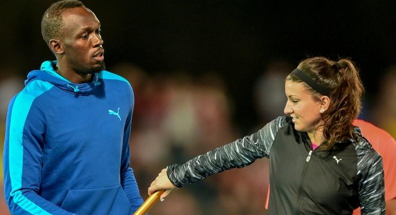 Bolt All Stars Captain Usain Bolt of Jamaica practices the baton exchange with his teammate Jenna Prandini of the US before their Mixed 4x100m relay event at the Nitro Athletics meet in Melbourne, on February 4, 2017