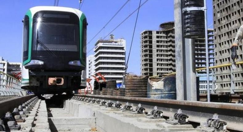 A labourer walks along a Metro-line construction in Ethiopia's capital Addis Ababa