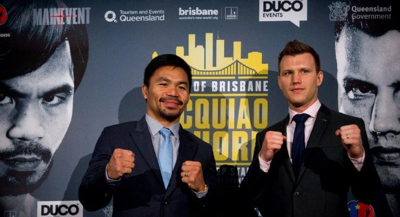 World Boxing Organization (WBO) welterweight defending champion Manny Pacquiao (L) of the Philippines poses for photos with Australian contender Jeff Horn during a press conference in Brisbane, in April 2017