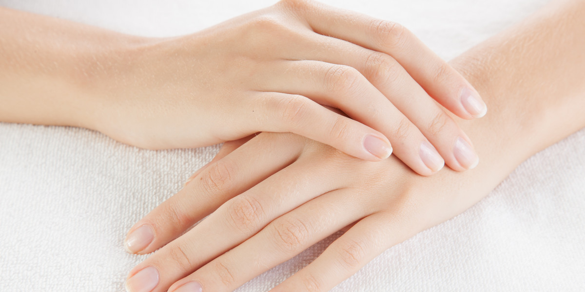 Beautiful woman hands are on a towel