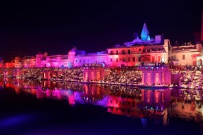 Participants light earthen oil lamps on the banks of the Sarayu river in an attempt to enter the Gui