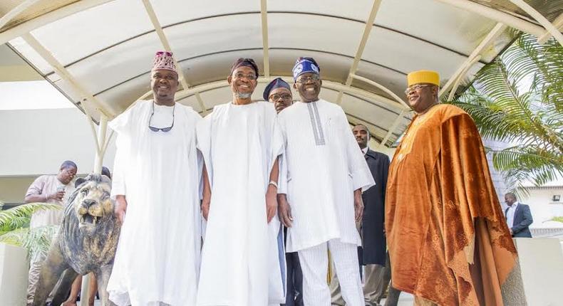 Aregbesola, Tinubu (center)