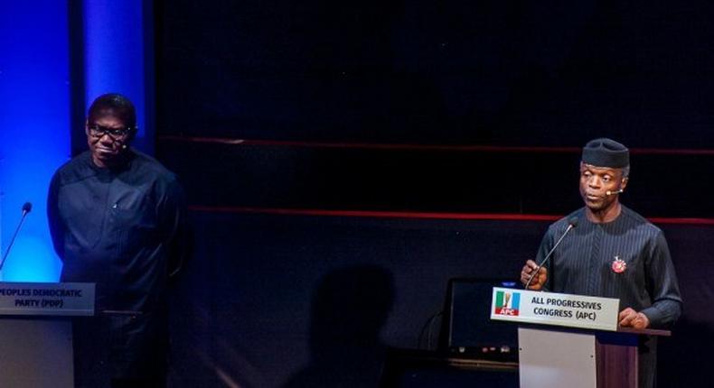 Vice President, Yemi Osinbajo (right), at the Vice Presidential Debate with vice presidential candidate of the People's Democratic Party (PDP), Peter Obi (left)