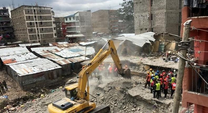 Rescue workers use a bulldozer as they continue to search for survivors in Huruma neighbourhood in the rubble of a six-storey building that collapsed in Nairobi, Kenya, May 5, 2016.     REUTERS/Thomas Mukoya