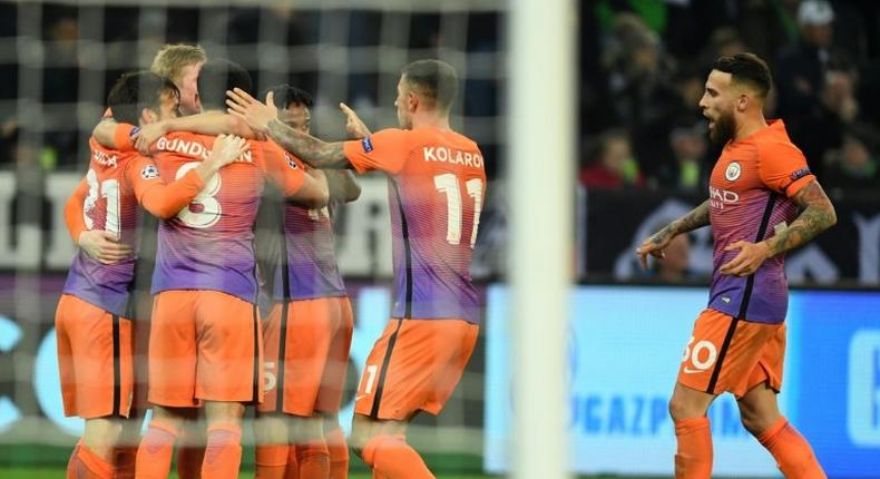 Manchester City's players celebrate equalizing during the UEFA group C Champions League football match between Borussia Moenchengladbach and Manchester City on November 23, 2016