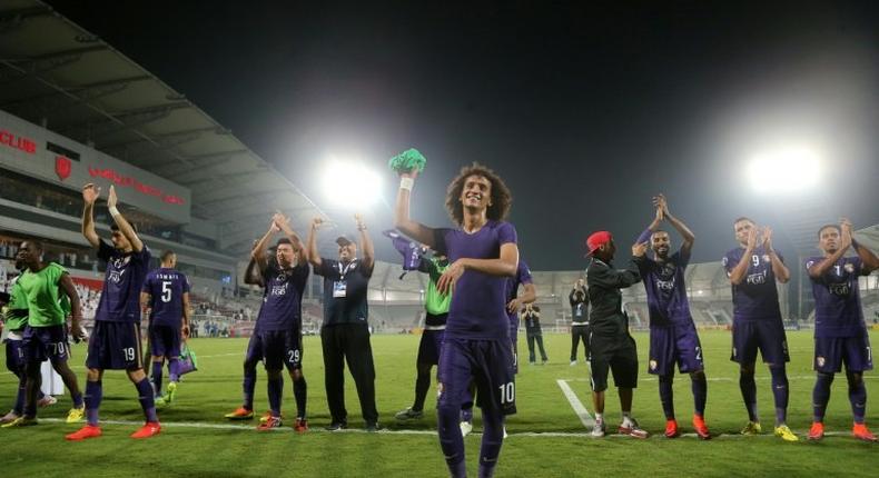 Al-Ain's Omar Abdulrahman (C) and teammates celebrate at the end of their Asian Champions League football match against Qatar's El-Jaish on October 18, 2016 in Doha