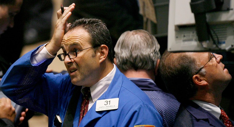 Traders work on the floor of the New York Stock Exchange August 9, 2007. 
