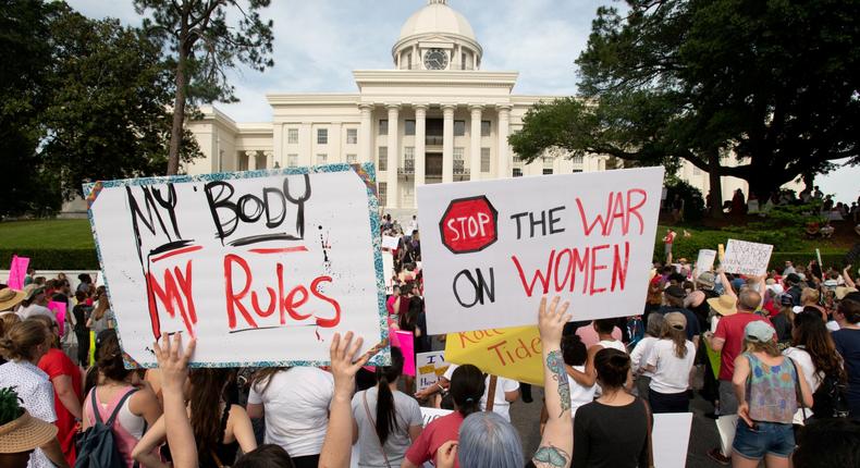 FILE PHOTO: People gather at the Alabama State Capitol during the March for Reproductive Freedom against the state's new abortion law, the Alabama Human Life Protection Act, in Montgomery, Alabama, U.S. May 19, 2019. REUTERS/Michael Spooneybarger/File Photo