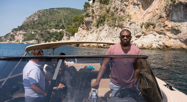 Don Jazzy driving a private boat on the French Rivera