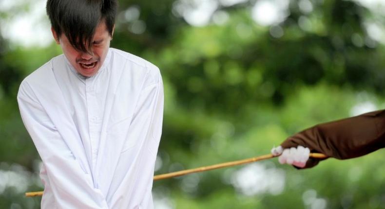 The two men received 83 strokes of the cane each after being found guilty of breaking sharia rules in conservative Aceh province