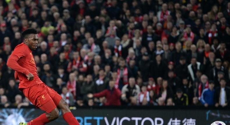 Liverpool's English striker Daniel Sturridge shoots to score their second goal during the English Football League Cup fourth round match between Liverpool and Tottenham Hotspur at Anfield in Liverpool north west England on October 25, 2016