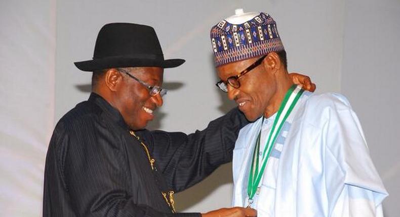 President Muhammadu Buhari and former president Goodluck Jonathan at a peace treaty meeting prior to Nigeria's March 28 and April 11, 2015 general election.