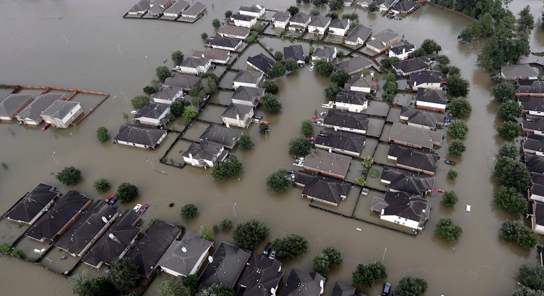 Homes are surrounded by floodwaters from 2017's Tropical Storm Harvey, in Spring, Texas.AP Photo/David J. Phillip