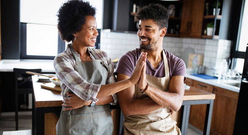 mother and adult son in the kitchen