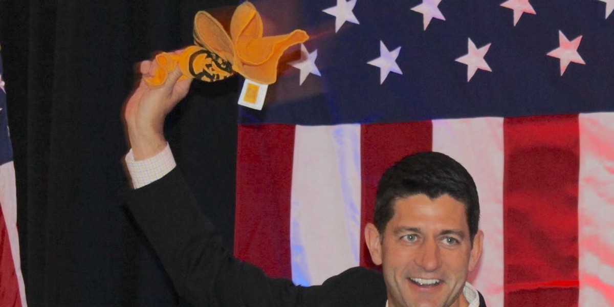 Green Bay Packers fan Paul Ryan waving a Pittsburgh Steelers terrible towel.