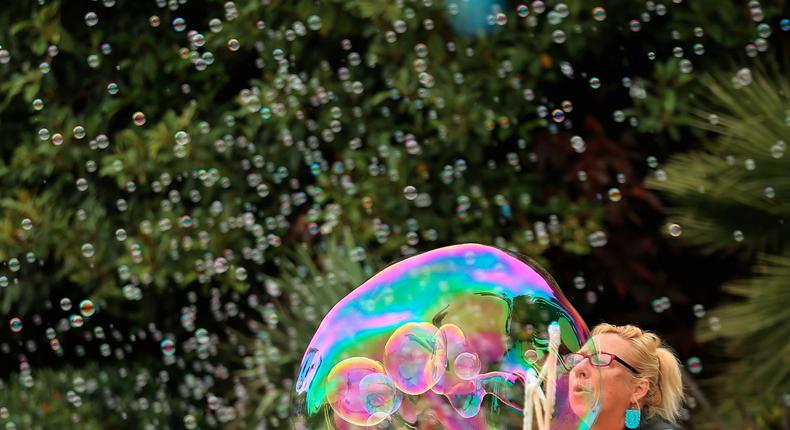 Ellyn Hae of The Bubble Show makes a bubble as she participates in the opening of a newly finished Ocean Explorer section at SeaWorld in San Diego, California.