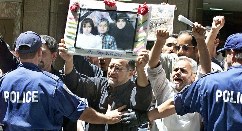 Families of those killed in the disaster protested in 2001 against Australia's hardline asylum-seeker policies