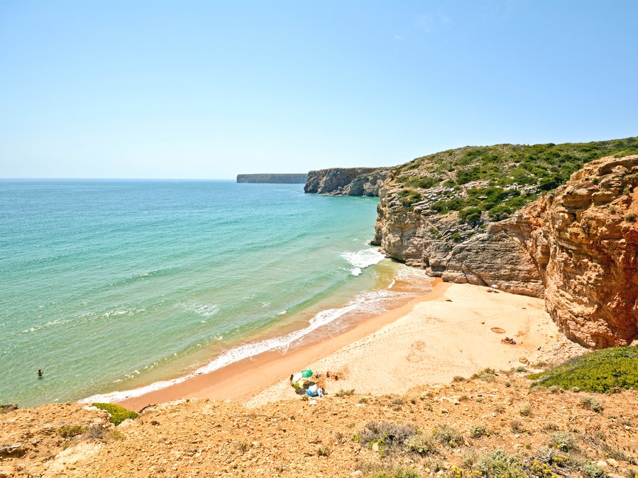 Praia do Beliche sits nestled between massive cliffs near the town of Sagres, in Portugal. The golden-sand beach attracts surfers who come here for its challenging swells, as well as sunbathers looking for a tranquil place to kick back and enjoy crystal-clear waters. The area also has some caves that provide shelter from the sun when you’d like to cool off.