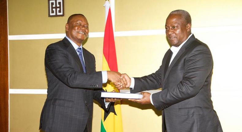 (File photo) Justice Senyo Dzamefe presenting the report to President John Mahama