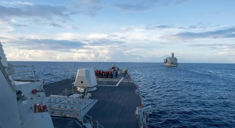 The USS Dewey (left) on duty in the South China Sea on May 19, 2017