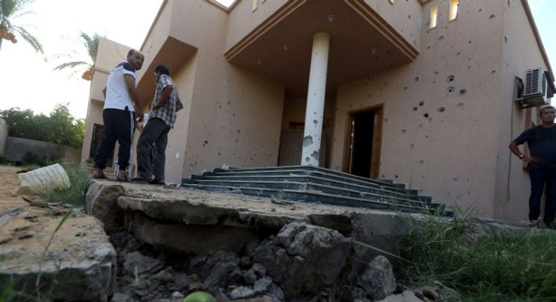 Libyans gather at the site of a mortar explosion in the capital Tripoli on August 30, 2018