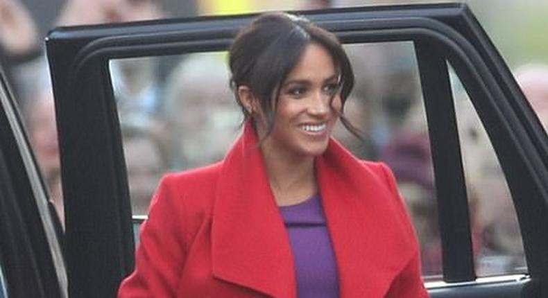 Meghan Markle is a vision in a cromson coat for official royal engagment