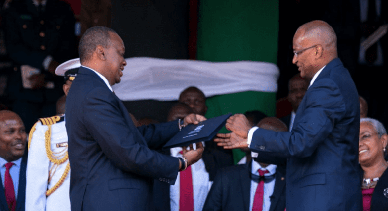 CBK Governor Patrick Njoroge presents the new generation notes to President Uhuru Kenyatta on 01 June 2019  during the Madaraka Day celebrations in Narok