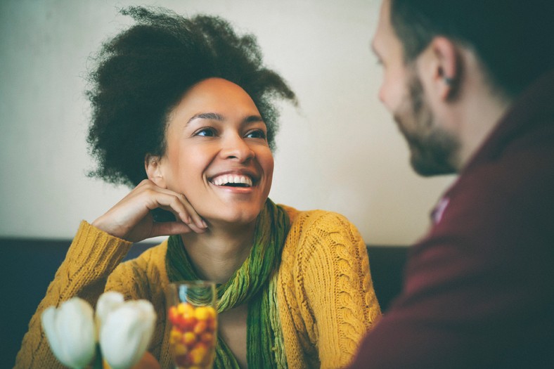 Happy woman on a date [Credit everyday feminism] 