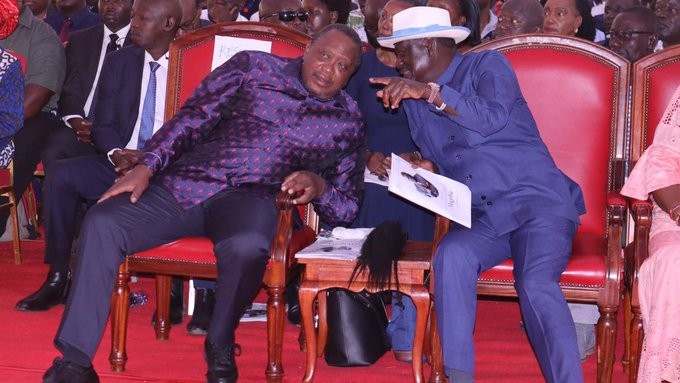Former President Uhuru Kenyatta and Raila Odinga at Magoha's burial