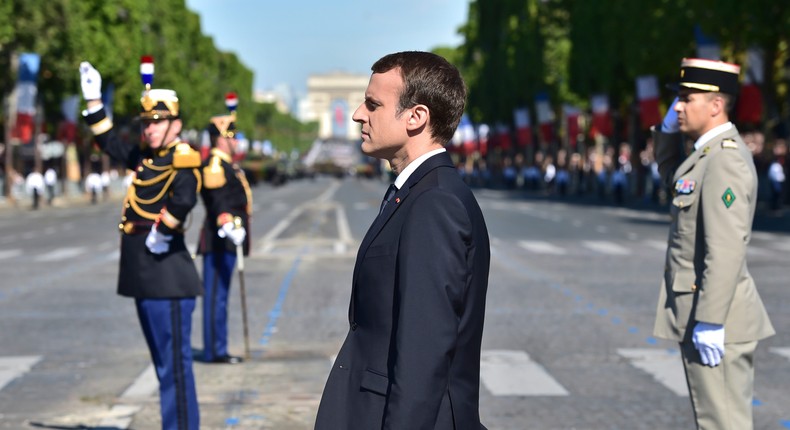 French President Emmanuel Macron stands at attention during the Bastille Day parade in Paris, July 14, 2017.
