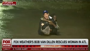 Fox Weather reporter Bob Van Dillen seen rescuing woman from flood waters live on air.Fox Weather/YouTube/Business Insider Screenshot