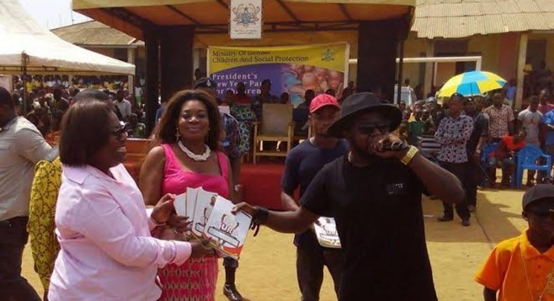 Guru donating 1000 books at a social gathering organized by The Ministry of Gender, Children and Social Protection at Moree in the central region of Ghana.