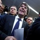 Sacked Catalan leader Carles Puigdemont departs after a news conference in Brussels