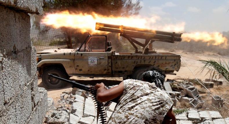 Libyan forces allied with the U.N.-backed government fire weapons during a battle with IS fighters in Sirte, Libya, July 21, 2016. 