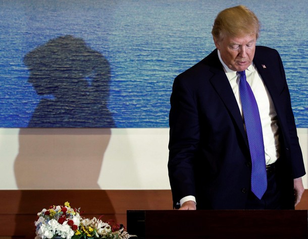 U.S. First Lady Trump casts shadow on wall behind U.S. President Trump in Seoul