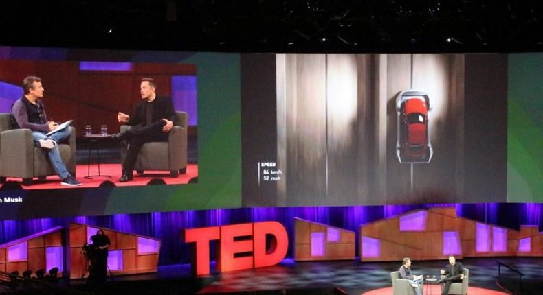 Elon Musk went teased the audience with a photo of a self-driving truck that his company Tesla Motors is adding to its line of electric cars